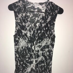 See threw Black and white V-neck flowy blouse.